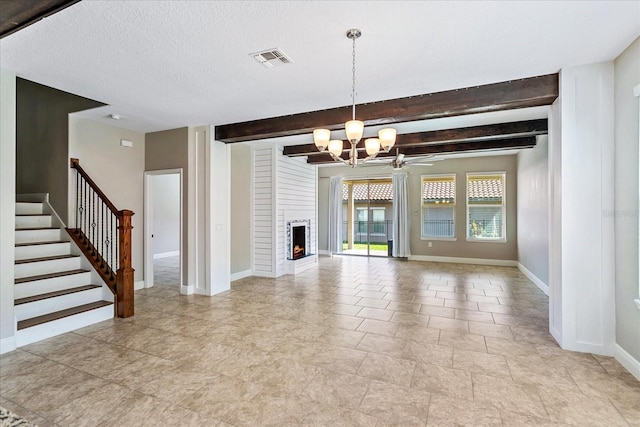 unfurnished living room with visible vents, beam ceiling, stairway, a large fireplace, and baseboards