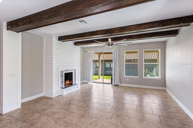 unfurnished living room featuring visible vents, a large fireplace, ceiling fan, baseboards, and beam ceiling