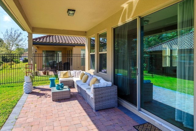 view of patio featuring outdoor lounge area and fence