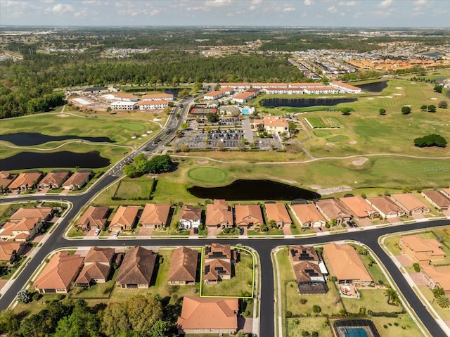 bird's eye view featuring a residential view, golf course view, and a water view