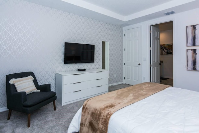 bedroom with visible vents, carpet, and wallpapered walls