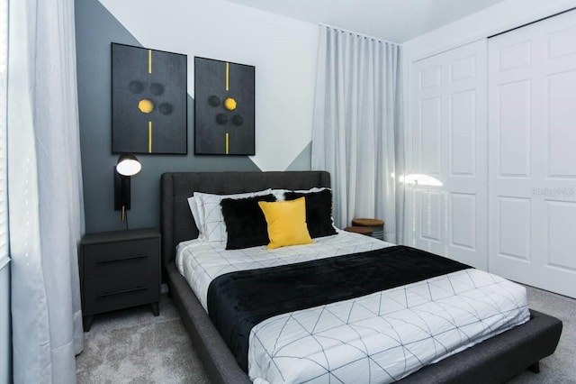 carpeted bedroom featuring a closet