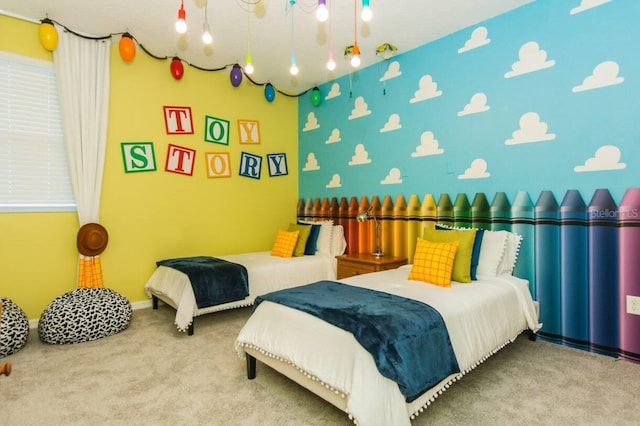 carpeted bedroom featuring baseboards