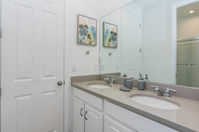 full bath with a sink and double vanity