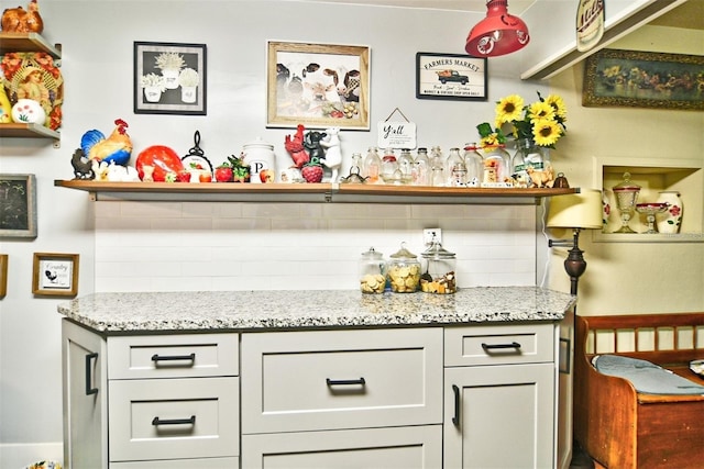 bar with decorative backsplash and a bar