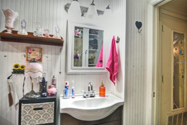 bathroom with vanity and visible vents