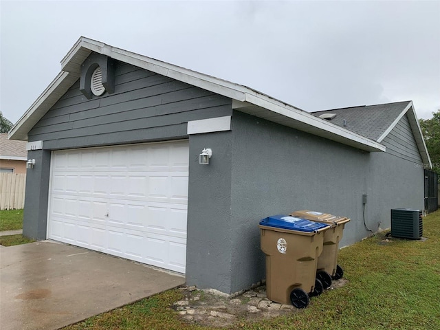 detached garage featuring cooling unit