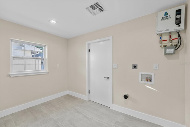 clothes washing area with electric dryer hookup, visible vents, washer hookup, baseboards, and laundry area