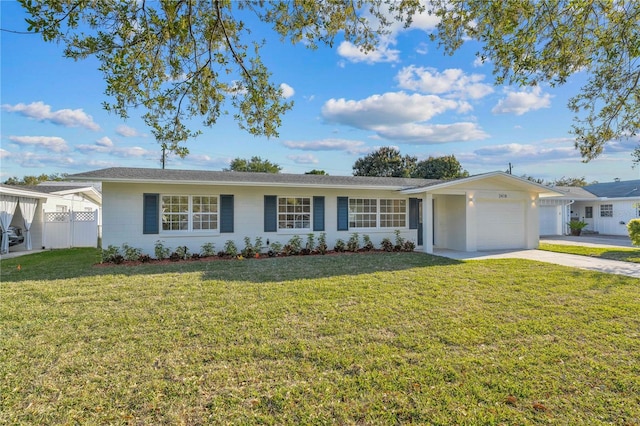 ranch-style home featuring driveway, a front yard, a garage, and fence