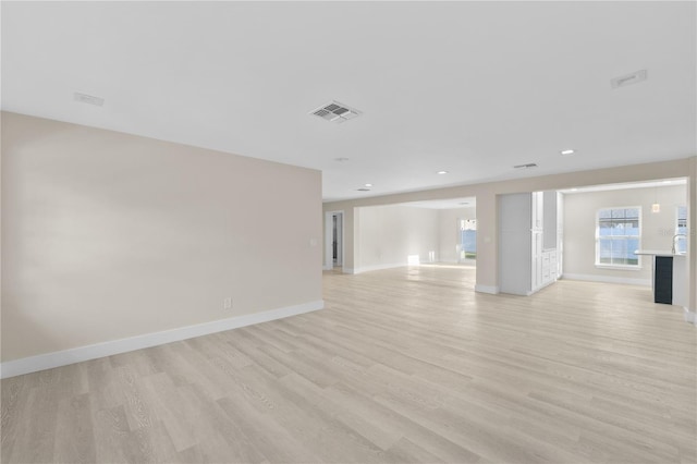 2418 Whitehall Cir, Winter Park, FL 32792 - interior space with light wood finished floors, baseboards, visible vents, and recessed lighting