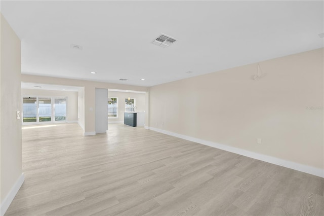 2418 Whitehall Cir, Winter Park, FL 32792 - unfurnished living room with recessed lighting, baseboards, light wood-style floors, and visible vents