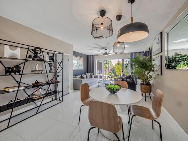 1174 Villa Ln Unit 115, Apopka, FL 32712 - tiled dining area with ceiling fan and baseboards
