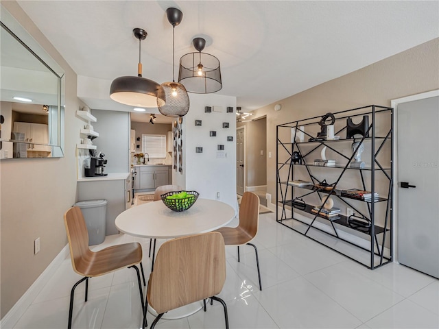 1174 Villa Ln Unit 115, Apopka, FL 32712 - dining space featuring light tile patterned floors and baseboards