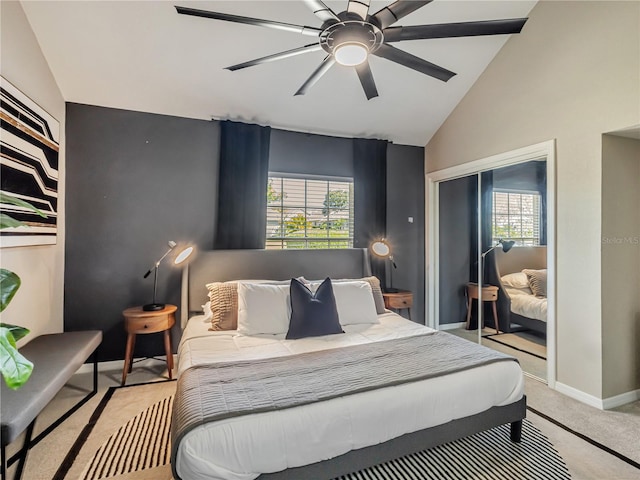 1174 Villa Ln Unit 115, Apopka, FL 32712 - bedroom with light colored carpet, a closet, ceiling fan, and high vaulted ceiling