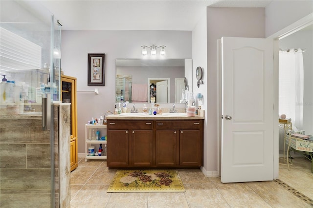 3823 Ryegrass St, Clermont, FL 34714 - full bathroom with double vanity, tile patterned floors, a tile shower, and a sink