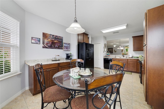 3823 Ryegrass St, Clermont, FL 34714 - dining room with baseboards, visible vents, and light tile patterned floors