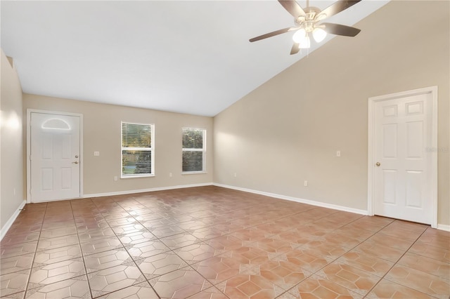 interior space featuring light tile patterned floors, baseboards, high vaulted ceiling, and ceiling fan