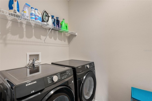 laundry room with laundry area and washing machine and dryer