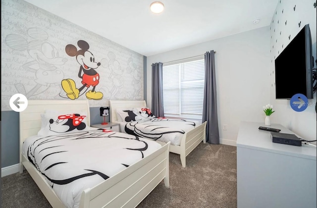 carpeted bedroom with baseboards, an accent wall, and wallpapered walls