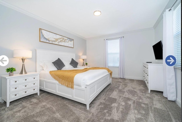 bedroom featuring crown molding, carpet flooring, and baseboards