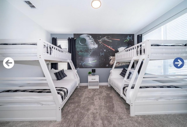 bedroom with visible vents, carpet floors, and baseboards