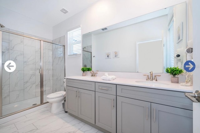 full bathroom featuring visible vents, marble finish floor, a marble finish shower, and a sink