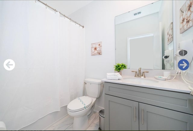 bathroom featuring visible vents, marble finish floor, toilet, and vanity