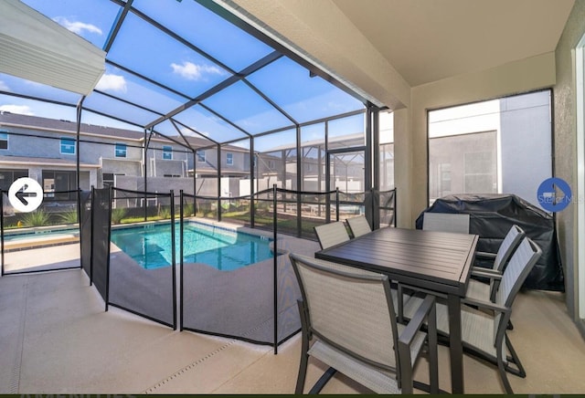 view of pool featuring a lanai, a residential view, a fenced in pool, and a patio