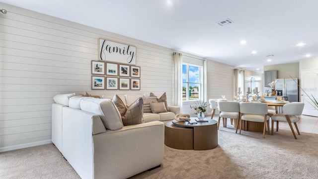 living room featuring visible vents, recessed lighting, baseboards, and carpet floors