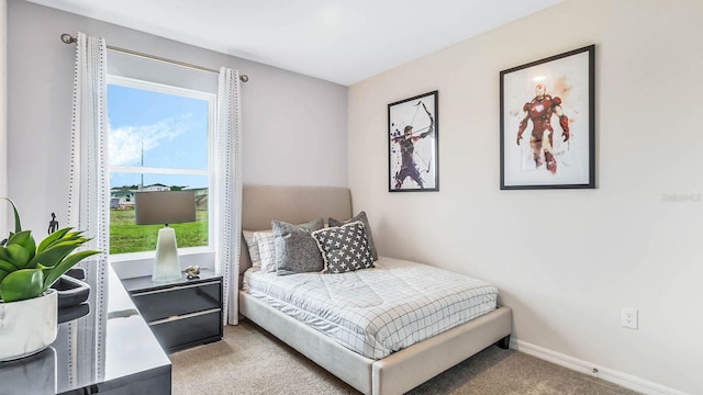 carpeted bedroom with baseboards