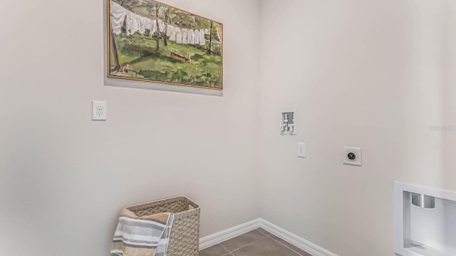 laundry area featuring baseboards, laundry area, electric dryer hookup, washer hookup, and tile patterned floors