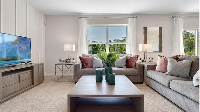 living area featuring light colored carpet