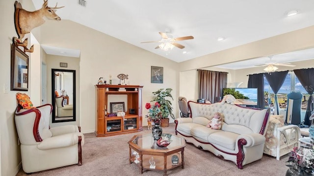 carpeted living room featuring visible vents, baseboards, ceiling fan, and vaulted ceiling