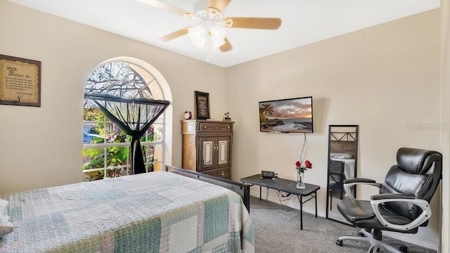 carpeted bedroom with ceiling fan