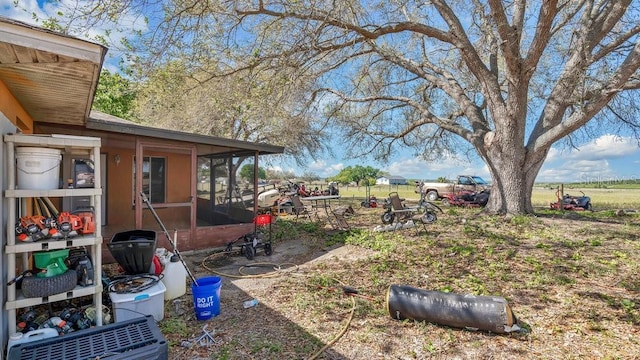 view of yard featuring a sunroom