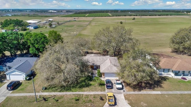 birds eye view of property with a rural view