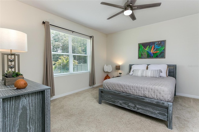 bedroom with carpet flooring, a ceiling fan, and baseboards