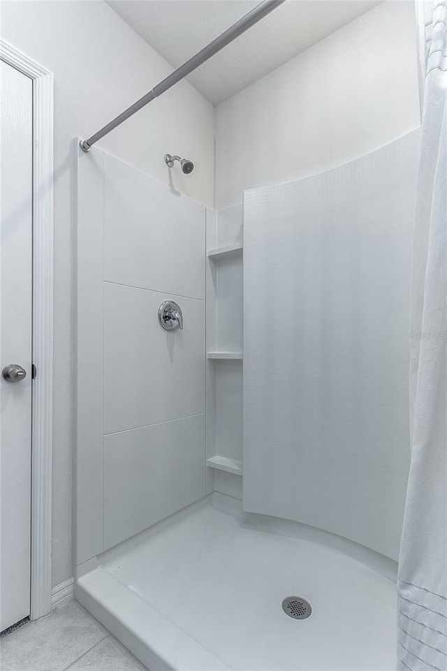 full bathroom featuring a shower stall