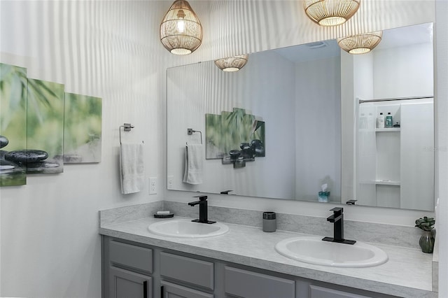 bathroom featuring double vanity and a sink