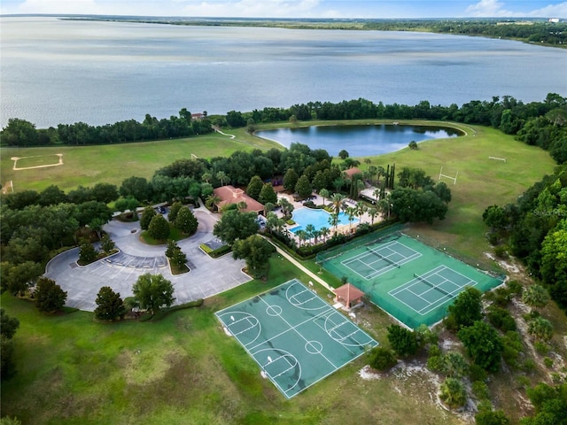 birds eye view of property with a water view