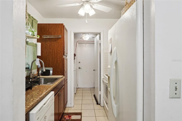 kitchen with a ceiling fan, a sink, white appliances, brown cabinetry, and light tile patterned floors