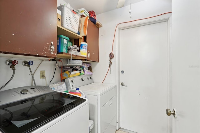 washroom with independent washer and dryer and laundry area