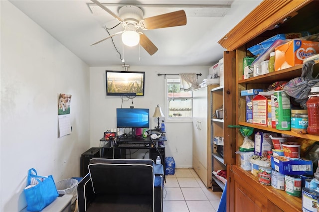 office space featuring light tile patterned floors and ceiling fan