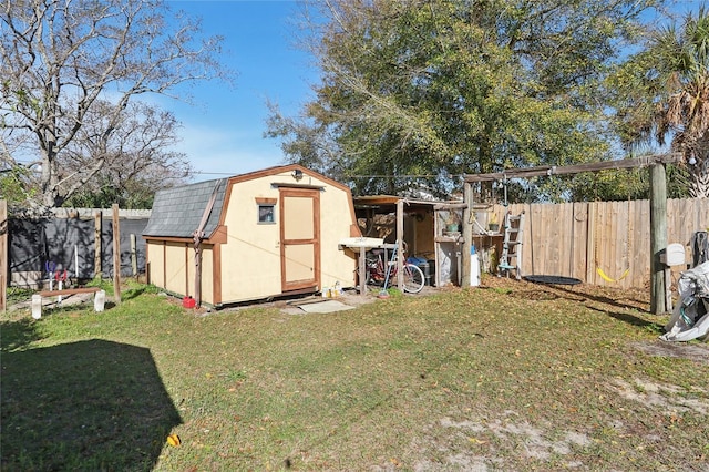 view of shed with a fenced backyard