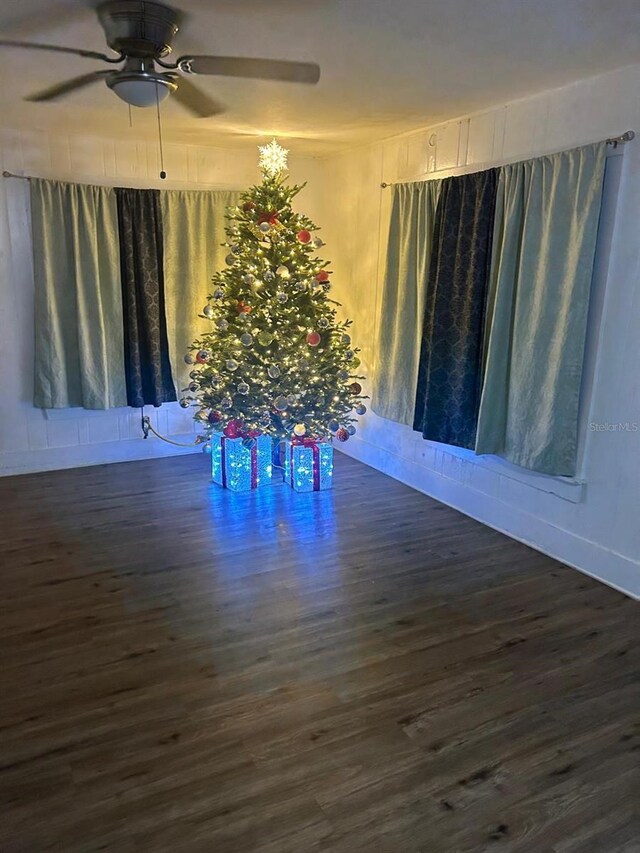 744 Myrtle Ave, Venice, FL 34285 - unfurnished dining area featuring a ceiling fan and dark wood-style flooring
