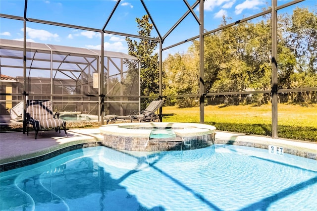 pool with glass enclosure, a lawn, an in ground hot tub, and a patio area