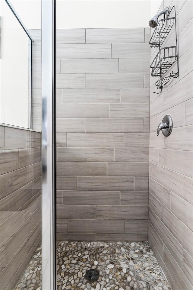 bathroom featuring a stall shower