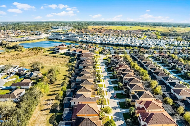 birds eye view of property with a residential view