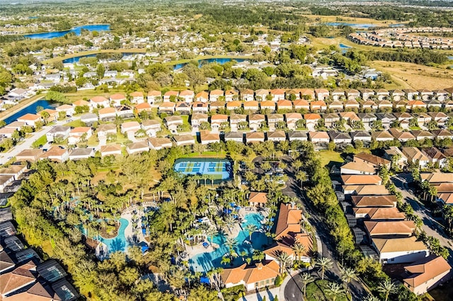 drone / aerial view featuring a residential view and a water view