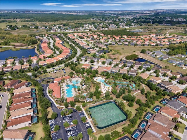 birds eye view of property with a water view and a residential view